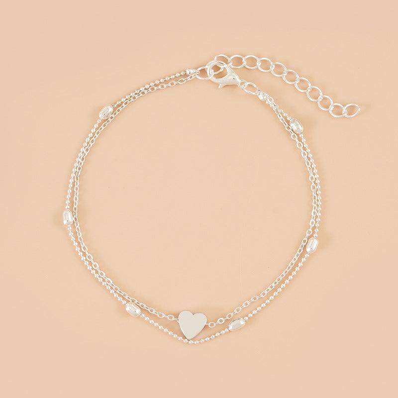 CONJUNTO 2 TORNOZELEIRAS A OURO 18K
