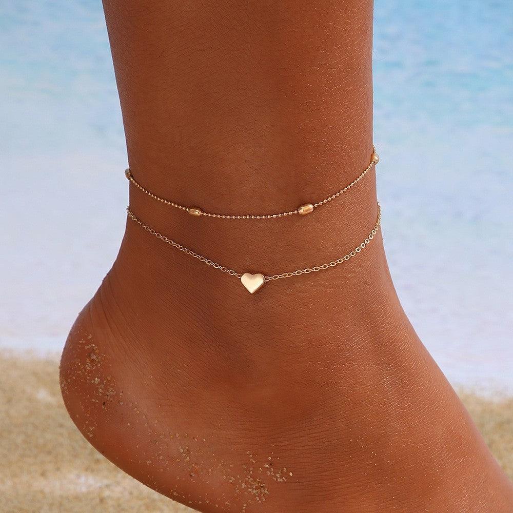 CONJUNTO 2 TORNOZELEIRAS A OURO 18K
