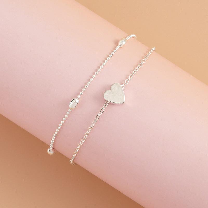 CONJUNTO 2 TORNOZELEIRAS A OURO 18K